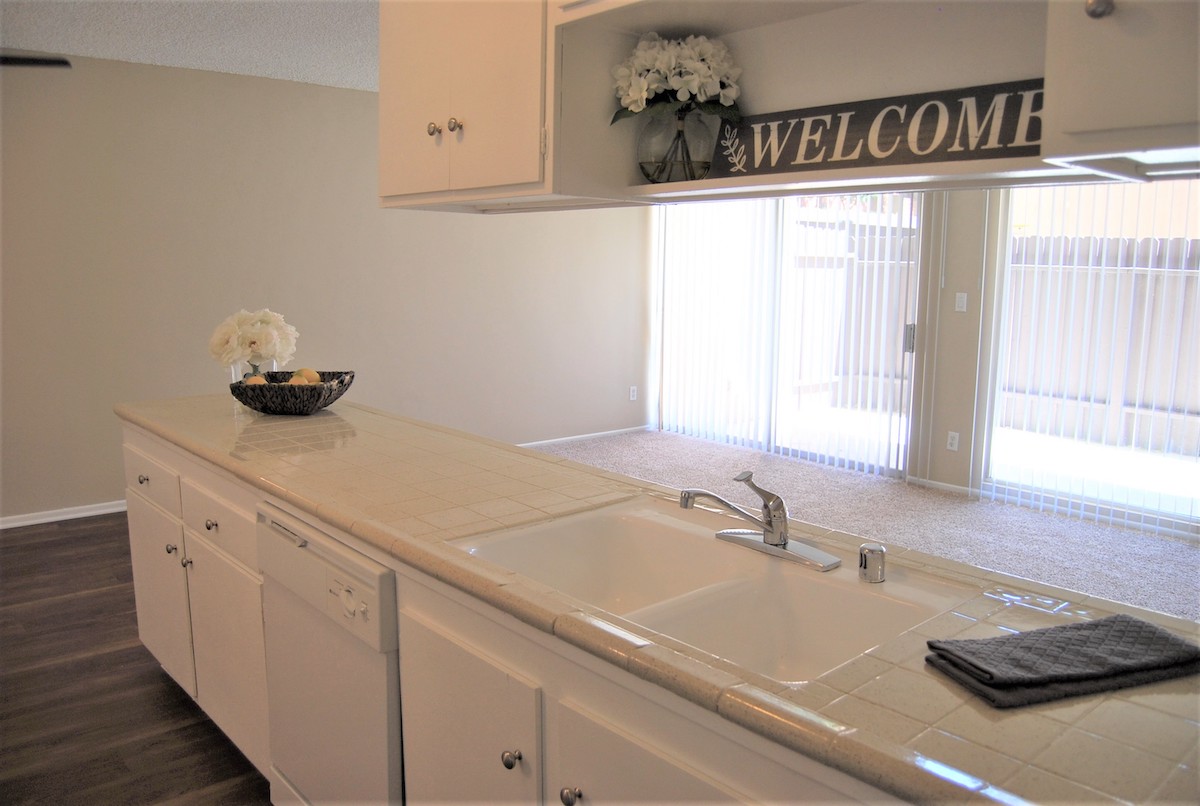 Kitchen sink with porcelain countertop.